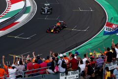 BUDAPEST, HUNGARY - AUGUST 03: Fans celebrate as pole position qualifier Max Verstappen of the Netherlands driving the (33) Aston Martin Red Bull Racing RB15 pulls into parc ferme ahead of second placed qualifier Valtteri Bottas of Finland and Mercedes GP during qualifying for the F1 Grand Prix of Hungary at Hungaroring on August 03, 2019 in Budapest, Hungary. (Photo by Charles Coates/Getty Images) // Getty Images / Red Bull Content Pool  // AP-2157QXQQD1W11 // Usage for editorial use only // Please go to www.redbullcontentpool.com for further information. //