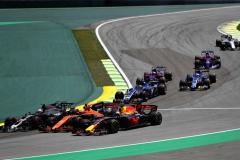 SAO PAULO, BRAZIL - NOVEMBER 12: Daniel Ricciardo of Australia driving the (3) Red Bull Racing Red Bull-TAG Heuer RB13 TAG Heuer Stoffel Vandoorne of Belgium driving the (2) McLaren Honda Formula 1 Team McLaren MCL32 and Kevin Magnussen of Denmark and Haas F1 battle into turn two at the start during the Formula One Grand Prix of Brazil at Autodromo Jose Carlos Pace on November 12, 2017 in Sao Paulo, Brazil. (Photo by Dan Istitene/Getty Images) // Getty Images / Red Bull Content Pool // P-20171112-00633 // Usage for editorial use only // Please go to www.redbullcontentpool.com for further information. //